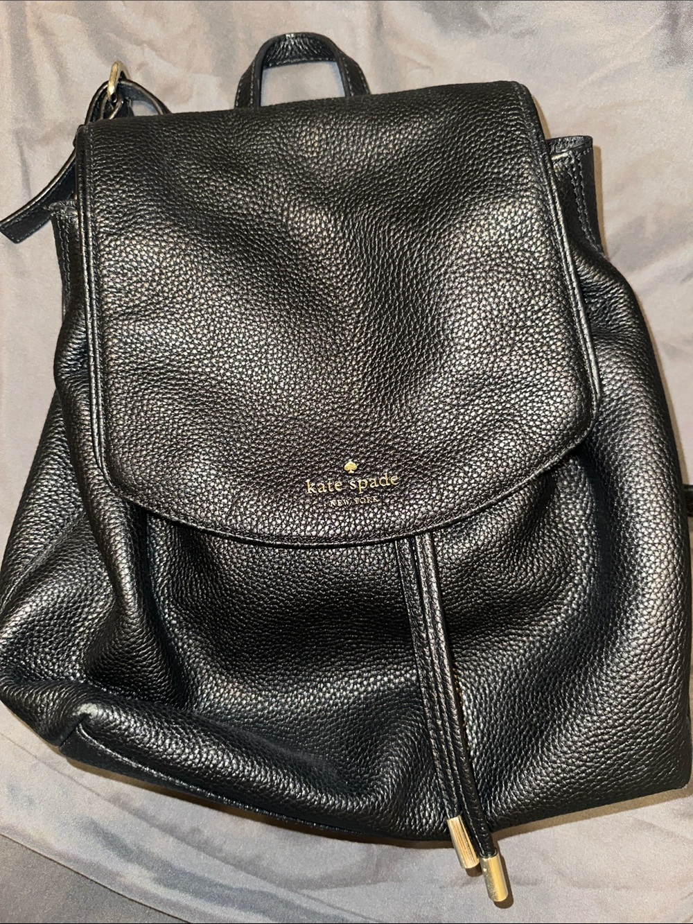 kate spade Black Pebbled Leather Drawstring Backpack with Gold Accents